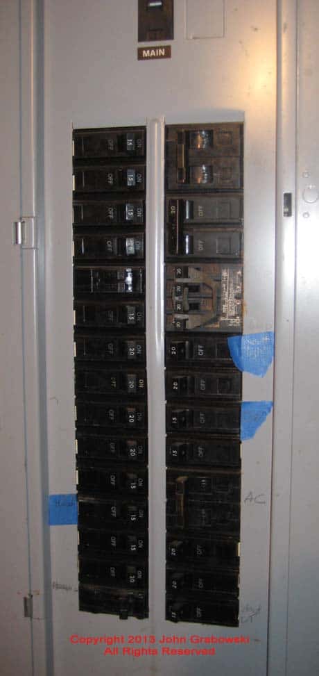 This is the "Before" picture of an existing GE main circuit breaker panel before the GE Interlock Kit Installation.