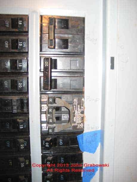  Another Before photo depicting the existing GE circuit breakers that need to be relocated to another part of the main panel or to a new GE sub-panel
