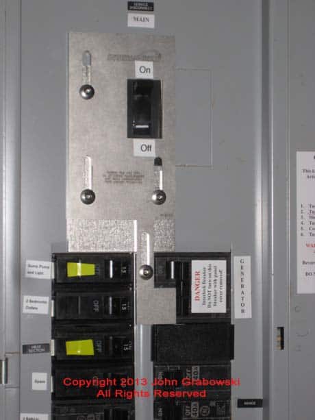 A Completed Main Breaker Interlock Kit Installation on an Existing GE Circuit Breaker Panel