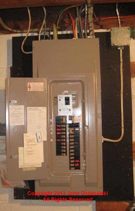 Completed interlock kit installation on an older Cutler Hammer type CH circuit breaker panel