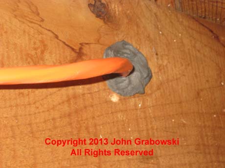 Duct Seal was also used inside where the 10/3 Romex penetrates through the rim joist to prevent air from coming into the basement.