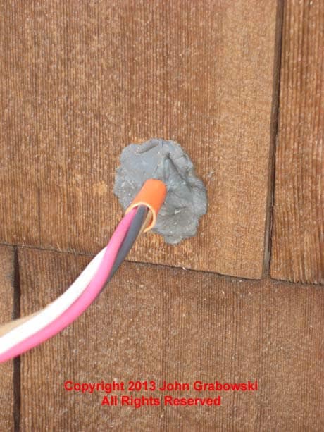 Duct Seal was used to seal the hole in the outside wall with the wire protruding to prevent air and moisture from getting inside