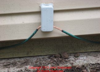 An Intersystem Bonding Termination mounted on a shed. The Green Grounding Electrode Conductor passes through the Intersystem Bonding Termination on its way to the second ground rod.