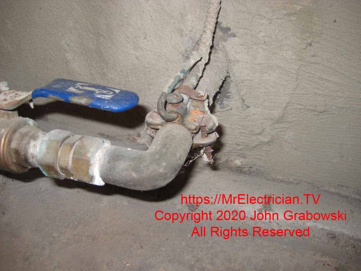 A corroded ground clamp with an armored grounding electrode conductor
