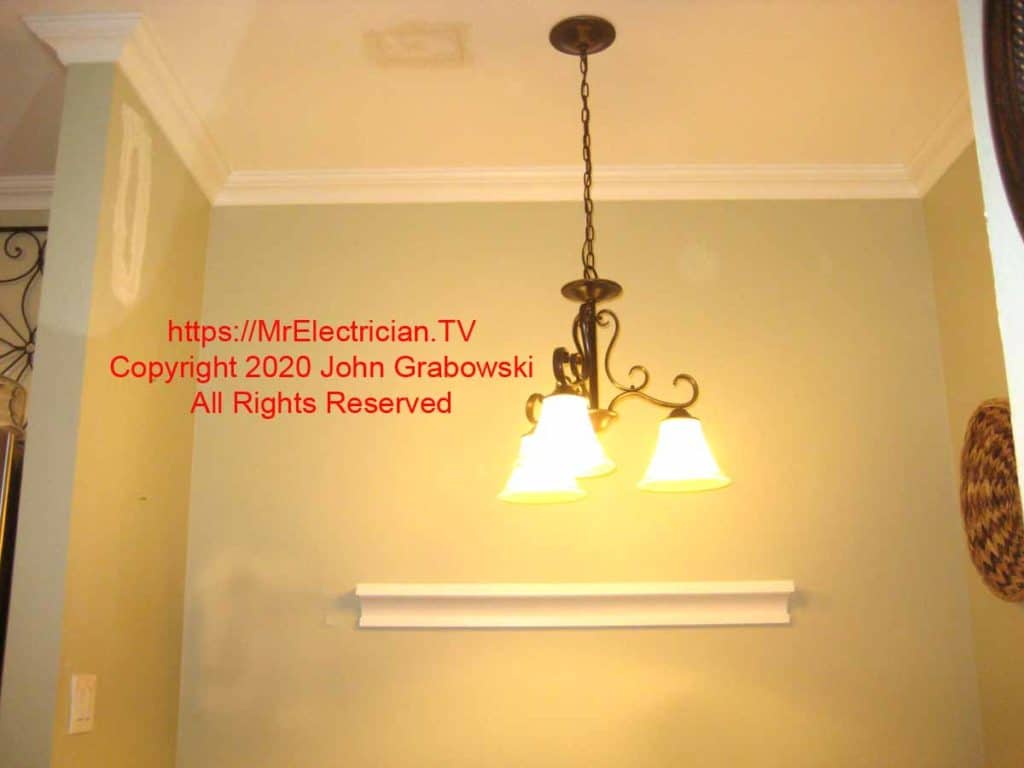 Completed installation of a ceiling light fixture and new dimmer switch