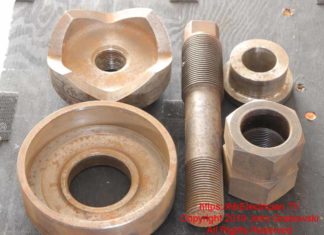 A three and a half inch conduit hand knockout punch with draw stud and accessories