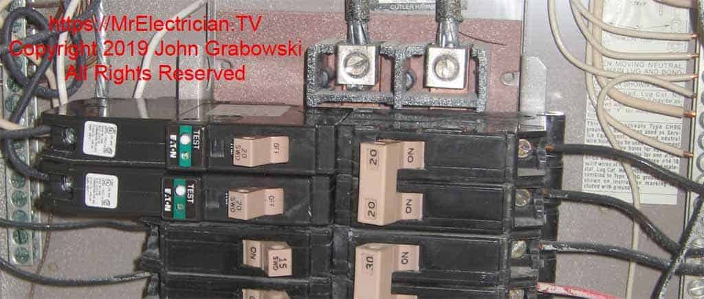 Two single pole 20 amp Cutler Hammer Type CH Arc Fault Circuit Interrupter circuit breakers in a load center