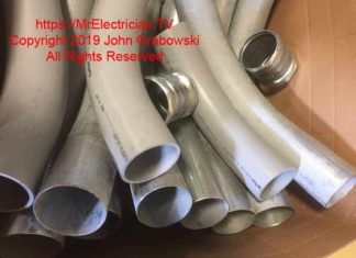 Photo of four inch PVC and EMT electrical conduit factory made elbows and EMT compression couplings