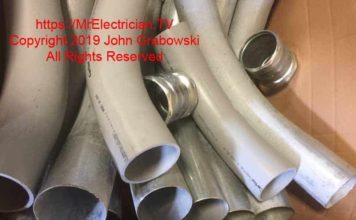 Photo of four inch PVC and EMT electrical conduit factory made elbows and EMT compression couplings