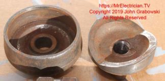 Two and a half inch trade size knockout punch and draw stud for punching a hole for two and half inch electrical conduit.