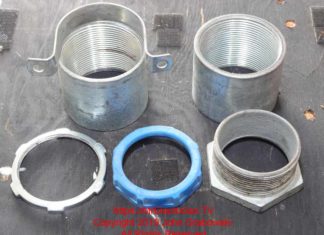 Two inch electrical conduit threaded couplings, and a chase nipple with locknut and bushing