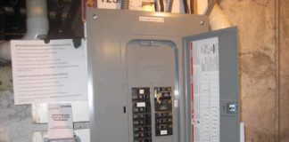 Completed generator sub-panel with a Square D generator interlock between the utility power main circuit breaker and the generator circuit breaker