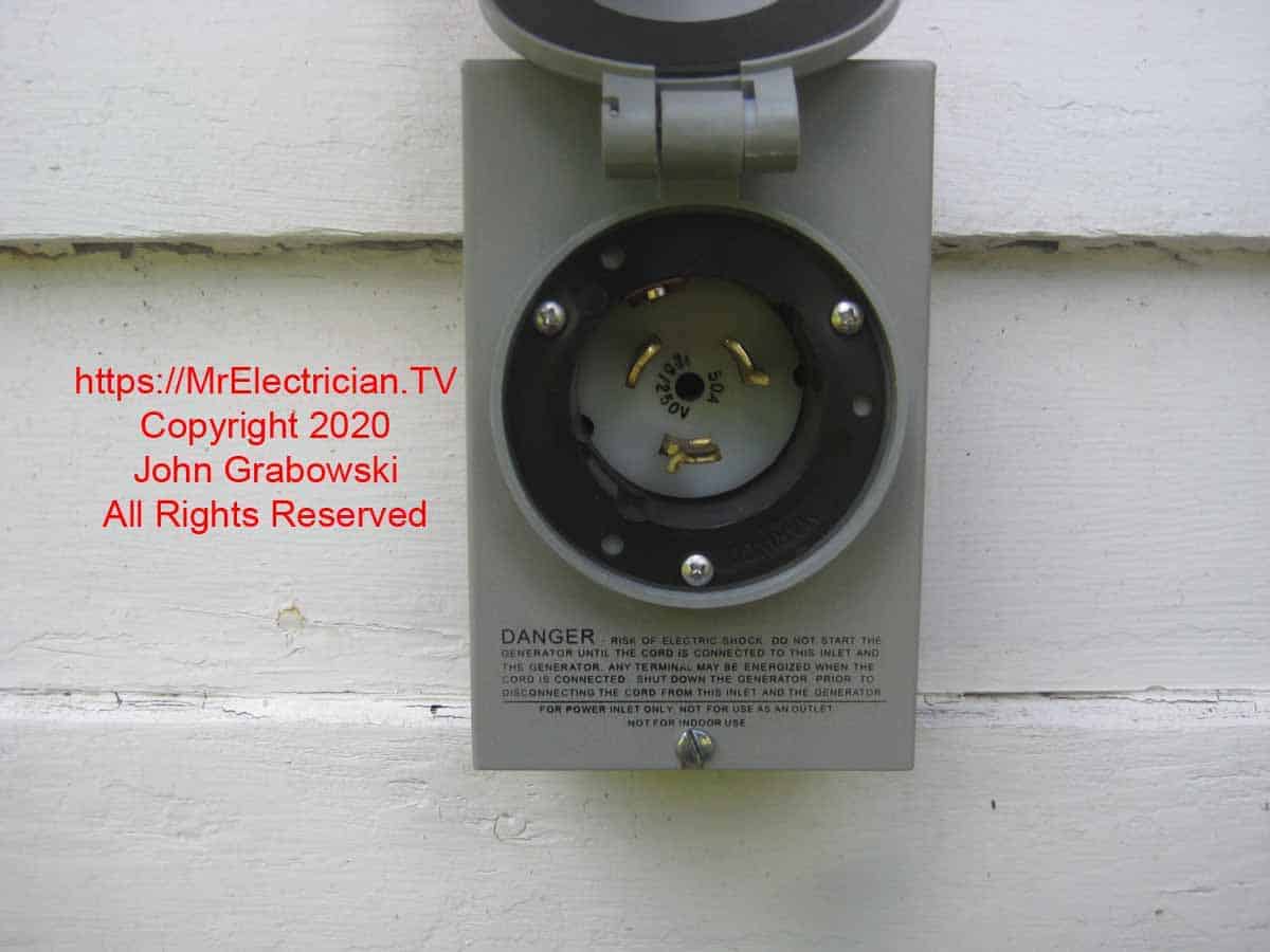 Reliance PB50 generator inlet with the cover open so that you can see the twistlock prongs