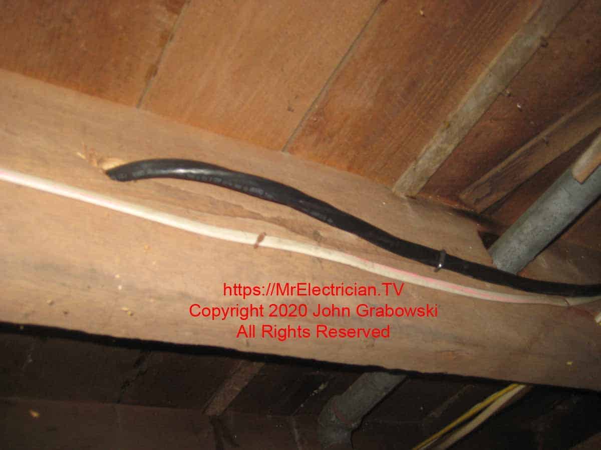 6/3 Type NM cable going through a joist in the basement