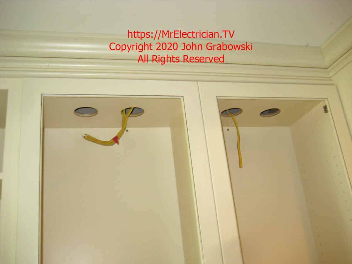 Four holes in top of kitchen cabinets for low voltage recessed lights