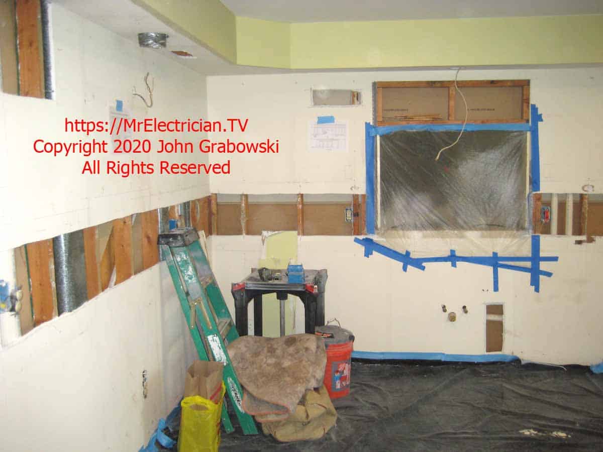 The wallboard has an opening approximately 12 inches wide at counter top height, going around the room. This is to facilitate the installation of electrical wiring for the new undercabinet lighting