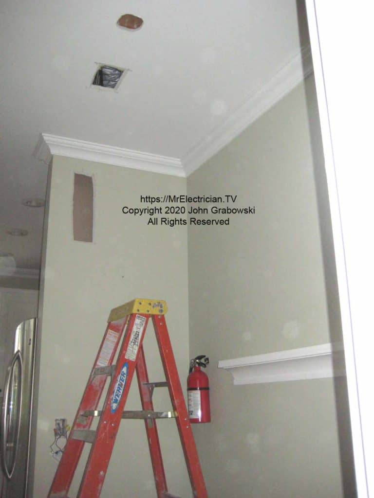 The access holes in the wall and the ceiling help to add a new wire to feed the new ceiling light fixture.