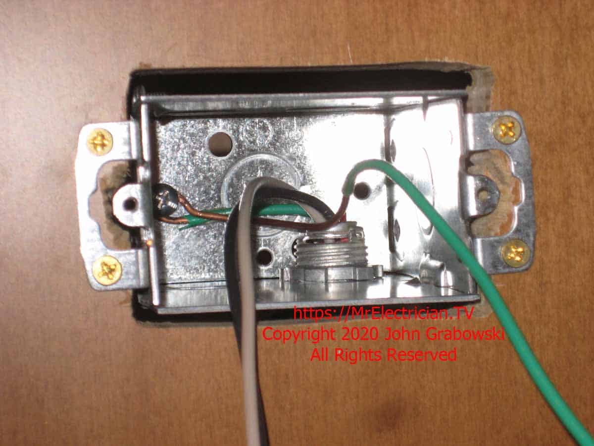 The 3.5 inch deep metal one gang electrical box mounted in the peninsula counter side all ready for an electrical outlet