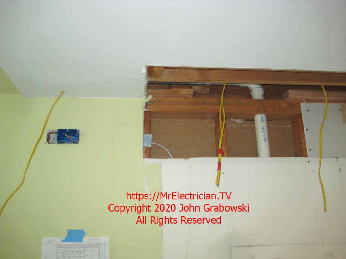 Low voltage wires roughed-in prior to the installation of the kitchen cabinets