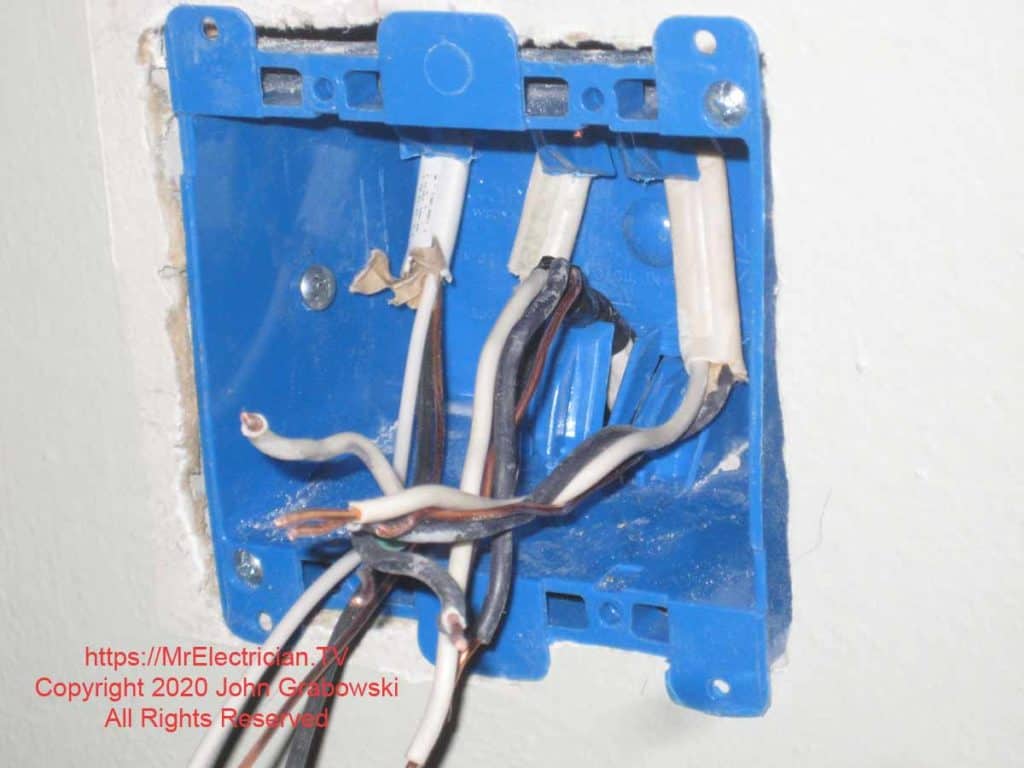The two gang plastic old work electrical box is mounted to the wall