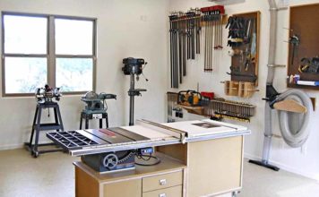 A very neat garage wood shop with windows