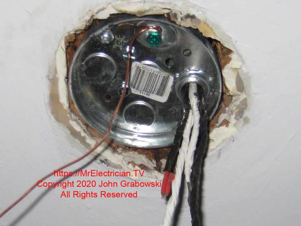 The finished replacement of an old style pancake ceiling electrical box ready for a standard light fixture The finished replacement of an old style pancake ceiling electrical box ready for a standard light fixture