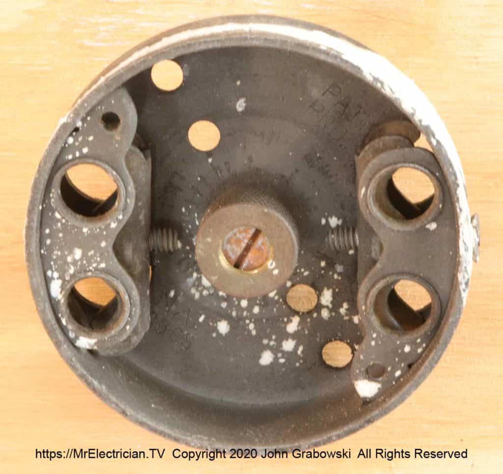 The front of a very old style pancake electric box The front of a very old style pancake electric box