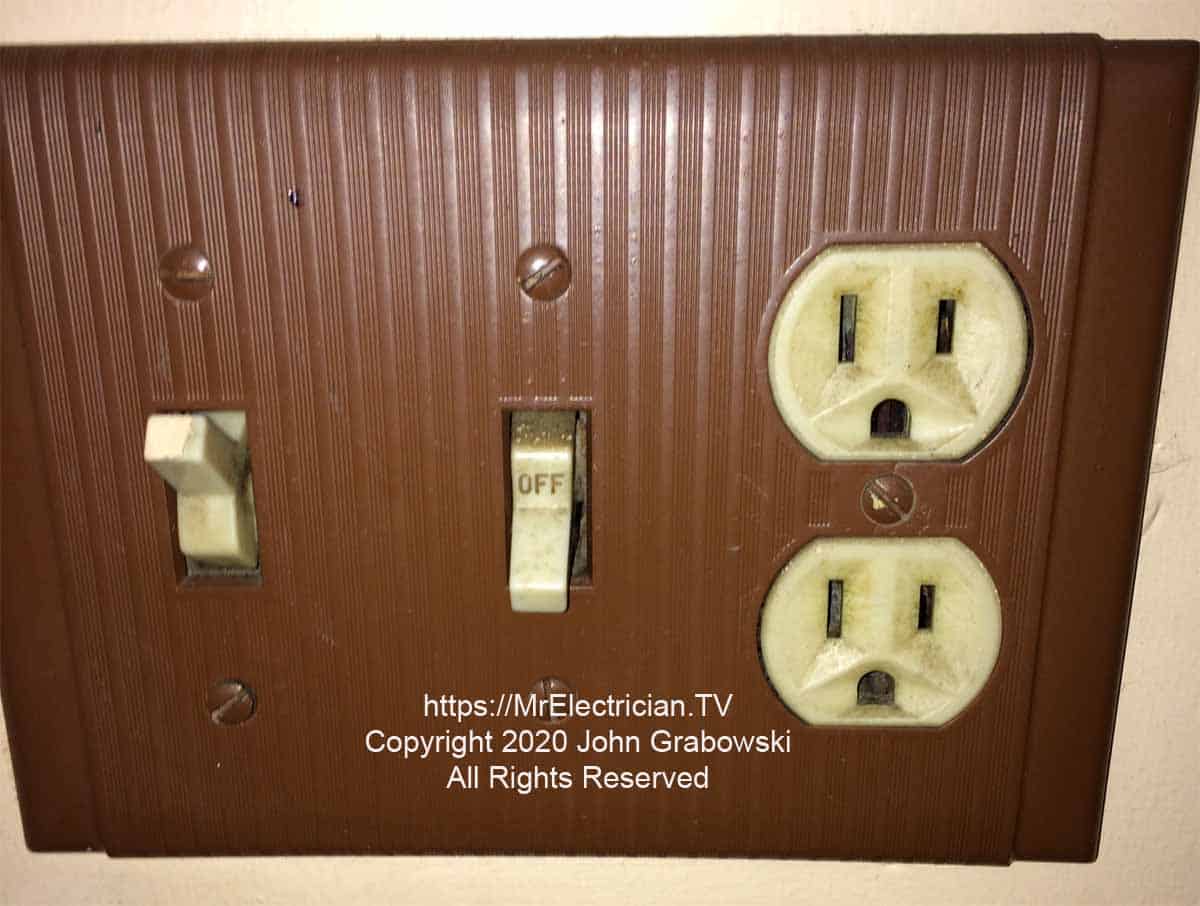 Two existing switches and one outlet with a brown wall plate