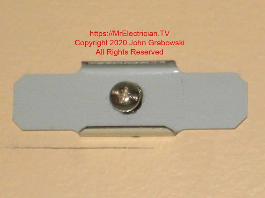 Wiremold support clip loosely mounted to ceiling with a toggle bolt