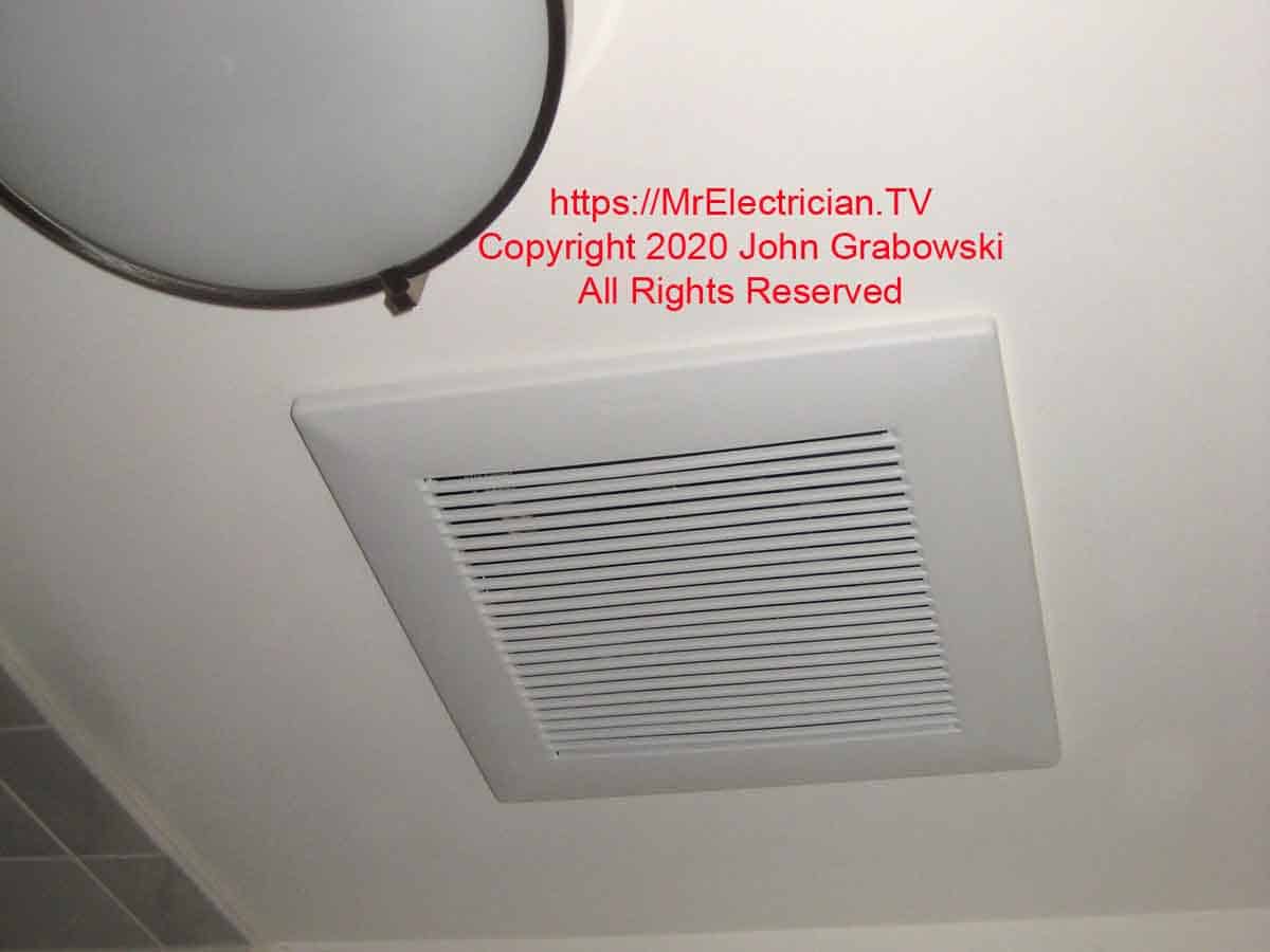 New bathroom fan grill next to the existing bathroom ceiling light fixture
