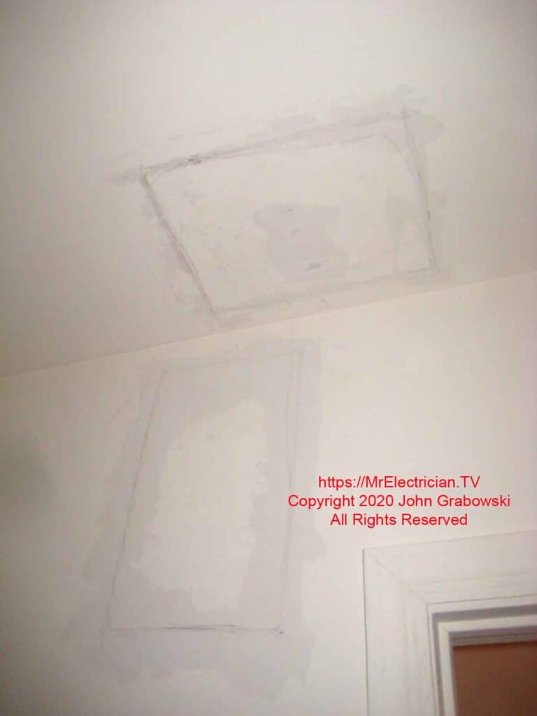 Patched holes in wall and ceiling