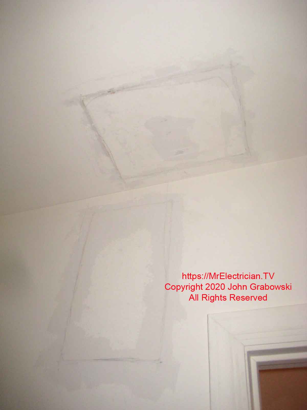 Patched holes in wall and ceiling