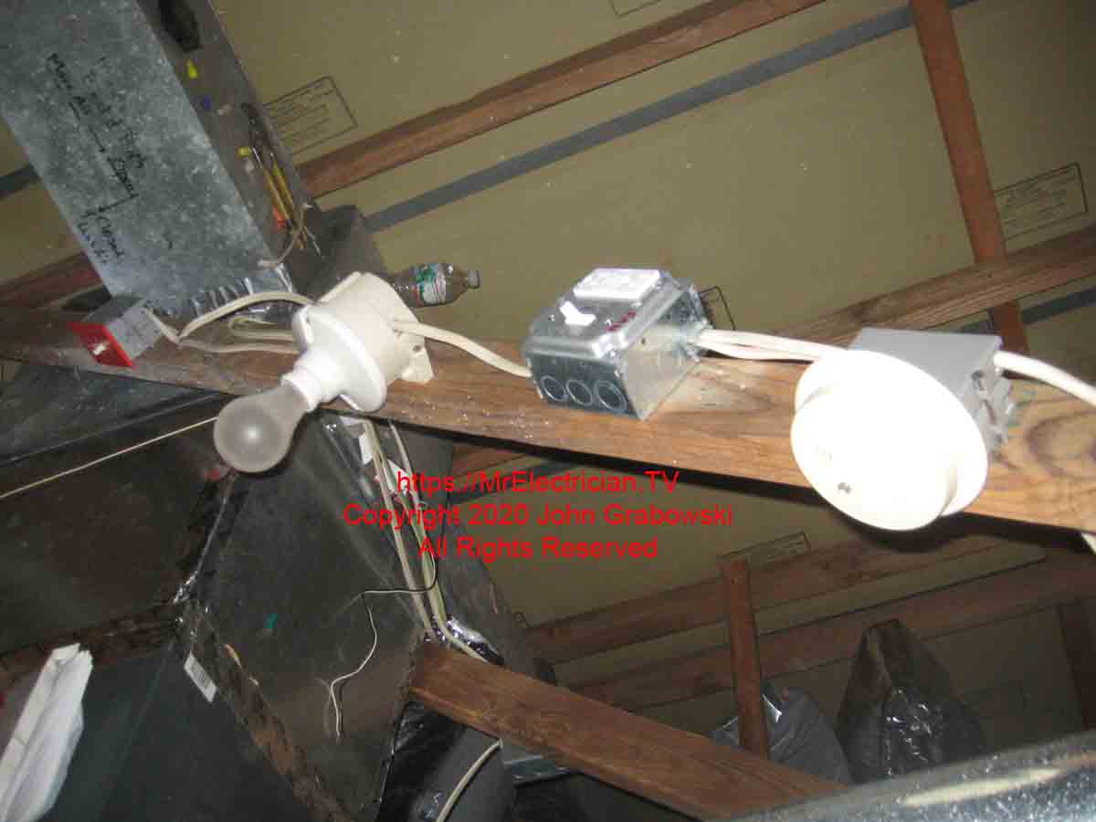 A new attic fan shut off switch with a GFCI receptacle in between a smoke alarm and an attic light