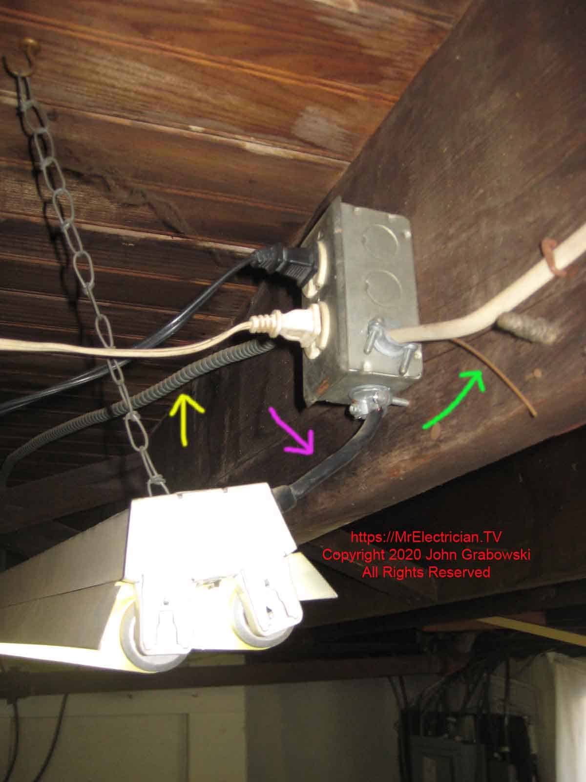 A basement light fixture was wired wrong through an electrical outlet.