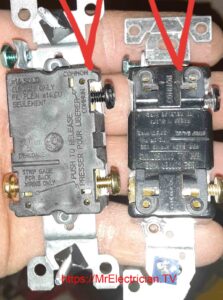 The back side of two three-way switches with arrows pointing to the COMMON terminal