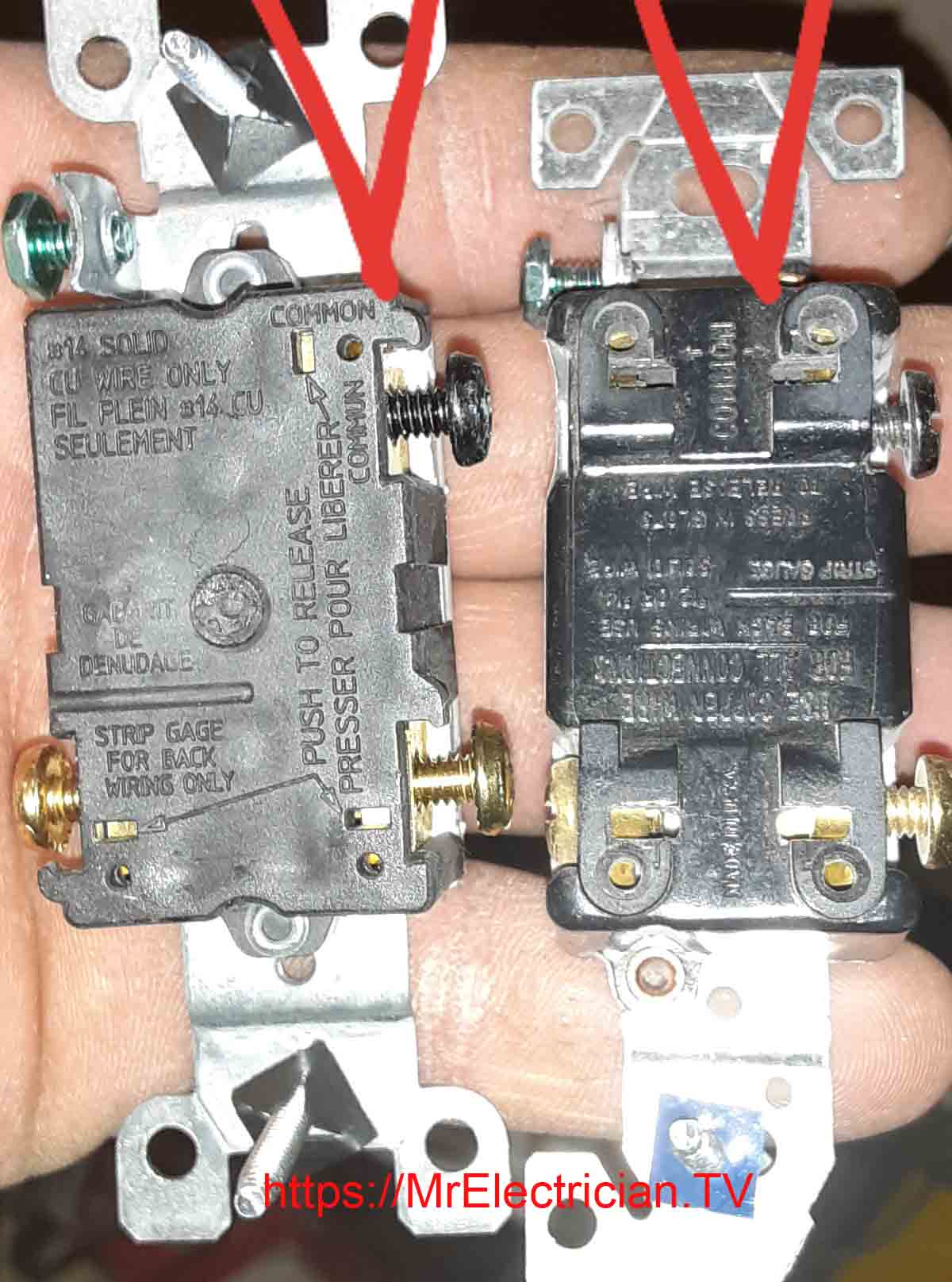 The back side of two three-way switches with arrows pointing to the common terminal