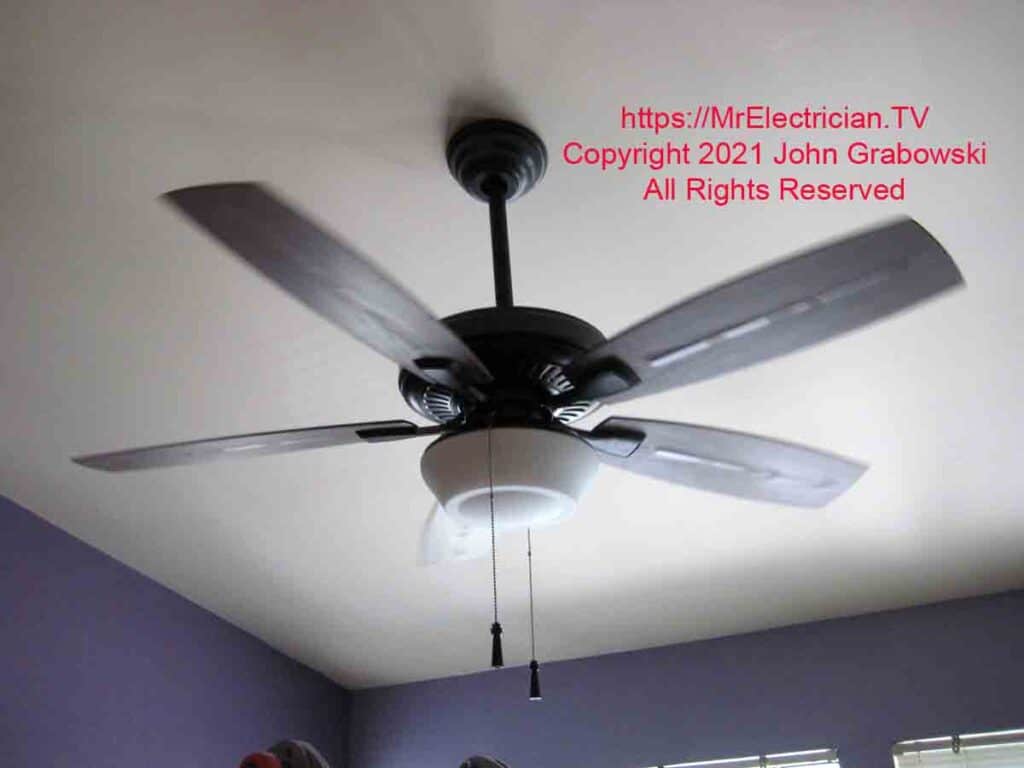 Ceiling fan photographed while spinning