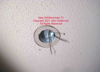 Drywall ring loosely fitted for size around a ceiling fan box