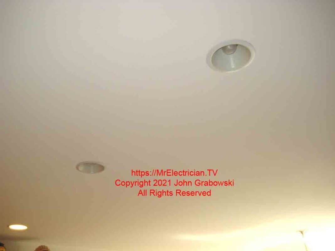 Recessed lights before being removed for the installation of pendant lights