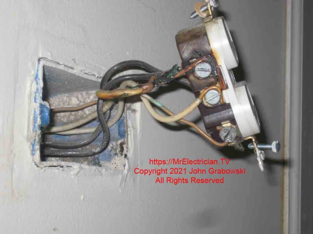Burned wire insulation due to long term arcing on an electrical outlet without Arc Fault Circuit Interrupter protection