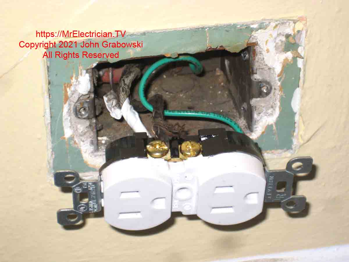 New tamper-resistant three-prong electrical outlet connected to old wiring and new grounding pigtail. This is how to ground a three-prong outlet that was changed from a two-prong outlet