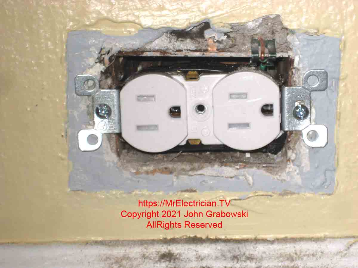 A new tamper-resistant electrical receptacle outlet installed in an old metal electrical outlet box. This is how to ground a two-prong outlet that is being replaced with a three-prong.