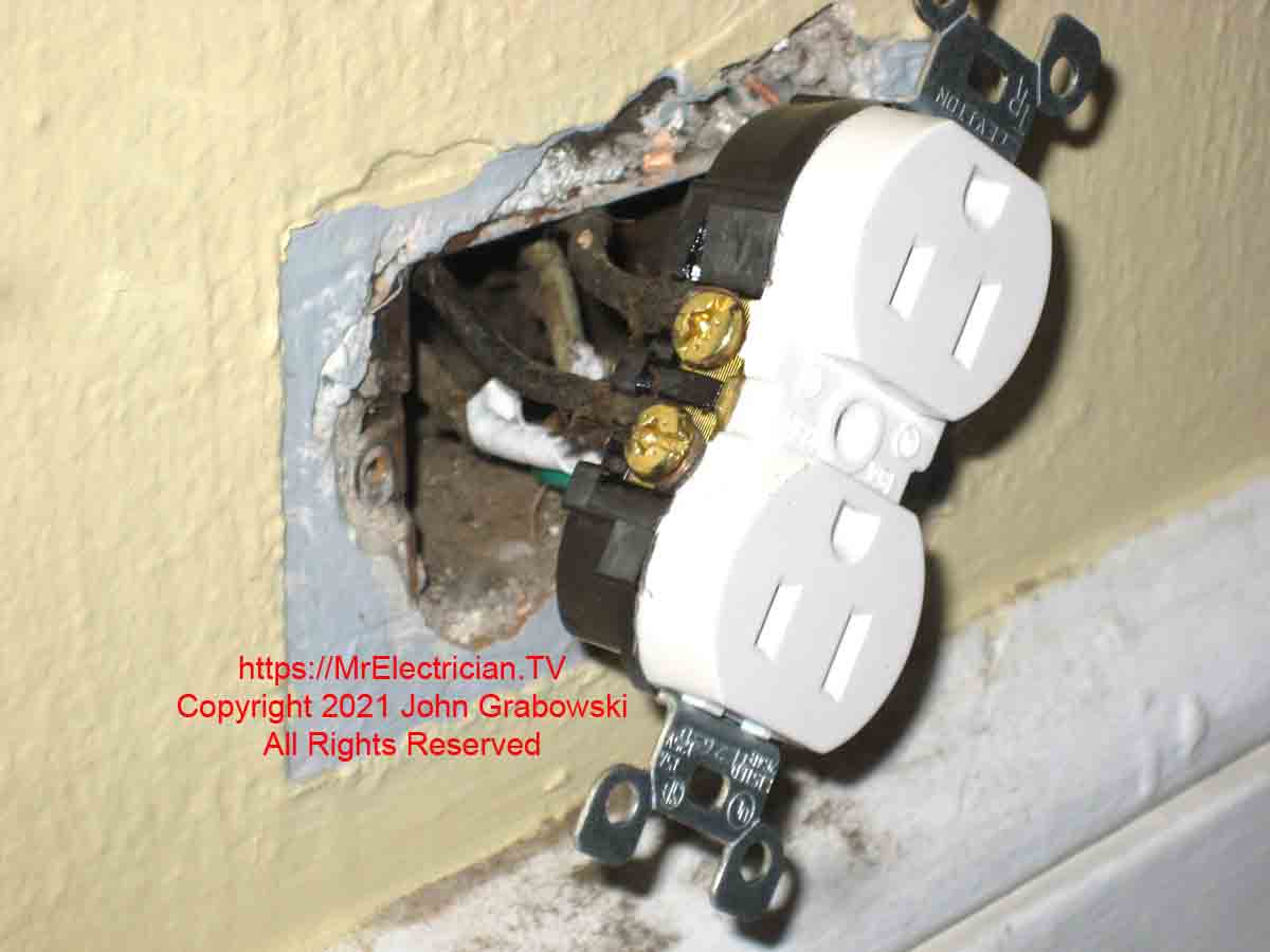 A new three-prong tamper-resistant electrical outlet that was installed on some very old wiring