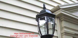 Outdoor light fixture mounted with an indoor electrical box, duct tape, and caulk