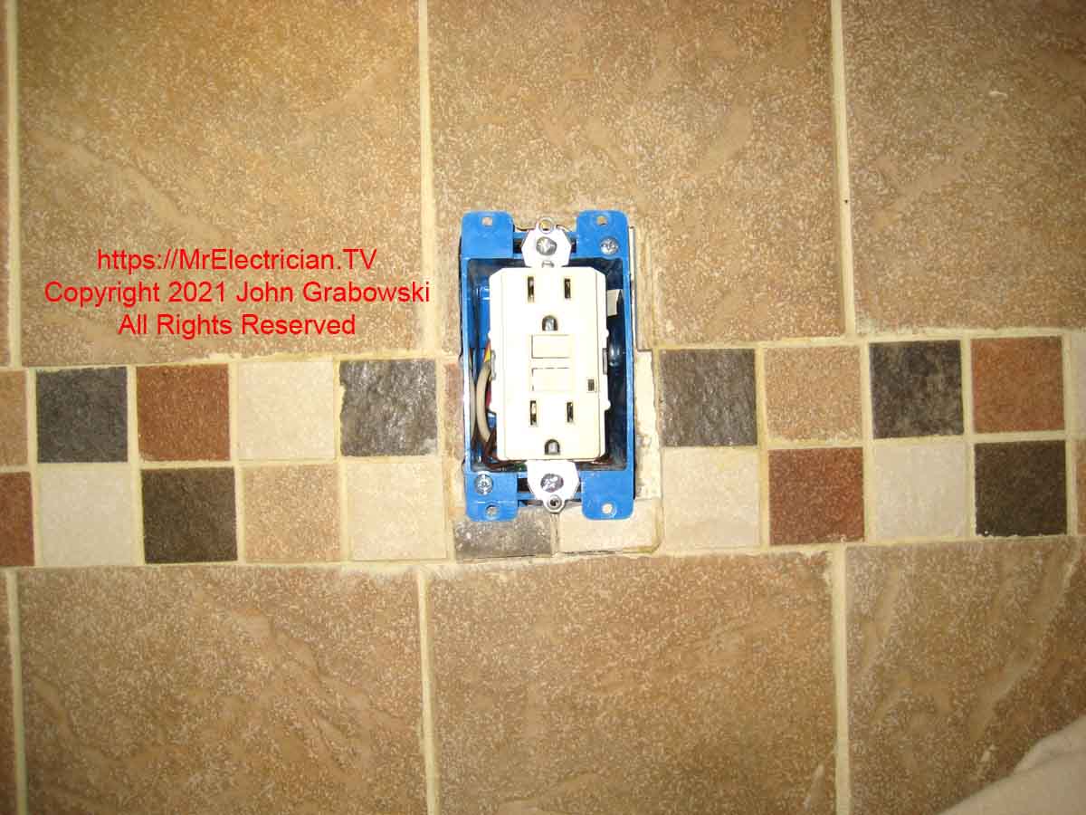 A new GFCI outlet was installed in the new outlet box that replaced the broken screw outlet box