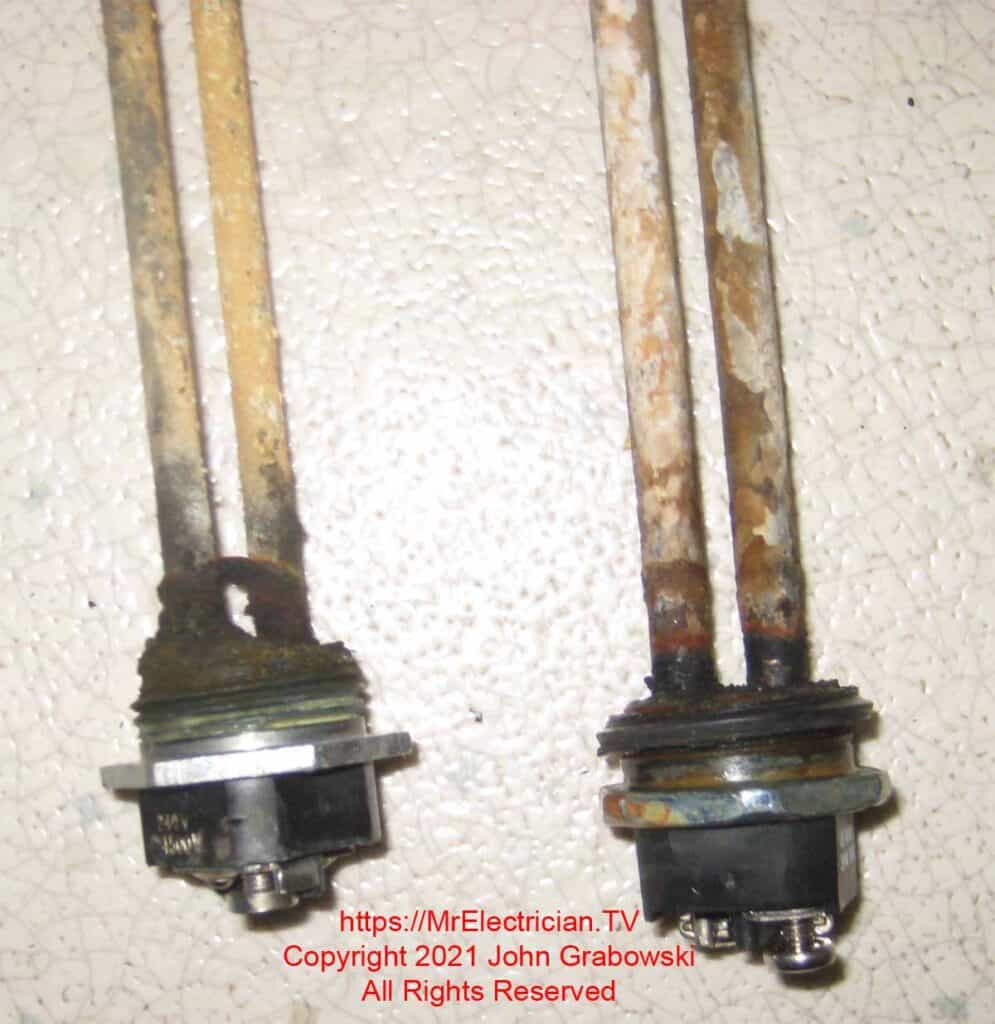 Picture of two old corroded heating elements.