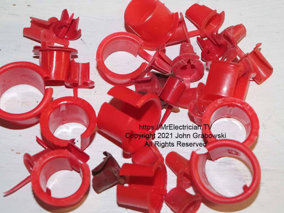 Several sizes of loose Anti-Short Bushings for BX cable, Type MC, and Flexible Metal Conduit