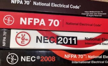 The spines of a few National Electrical Code books