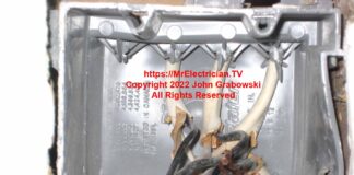 An incorrectly installed plastic electrical switch box with a broken screw connection point