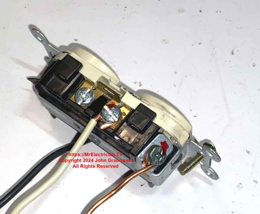 An electrical outlet with properly torqued tight electrical connections.